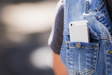 Smartphone in everyday life. phone in jeans pocket.