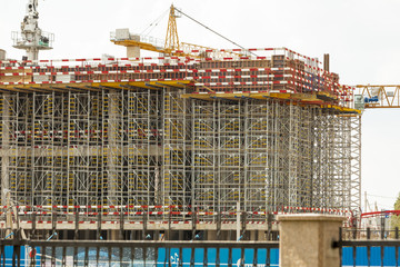 scaffolding and formwork in installation building fencing Tape on site.