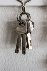 old key vintage hanging on cement wall background
