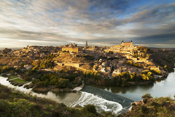 Fototapeta na wymiar Toledo city , world heritage site , at sunset , with Tajo river