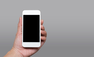 Hand holding blank black screen smart phone (mobile phone) at da