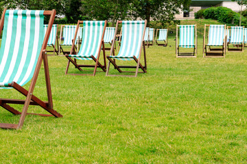 Green stripped deck chairs in Green Park, London