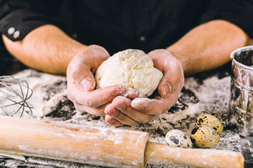 Hands kneading a dough