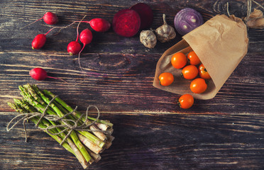 Fresh vegetable frame or border on textured slate with copyspace