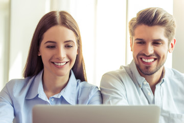 Obraz premium Beautiful business couple working