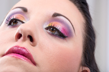 Obraz premium Young woman with fashion makeup