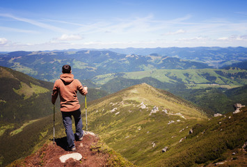 Man standing on the top of the mountain