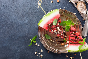 Watermelon slice popsicles with chocolate, nuts and mint © Iryna Melnyk