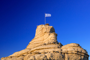 Greek flag on the rock at Zakynthos island