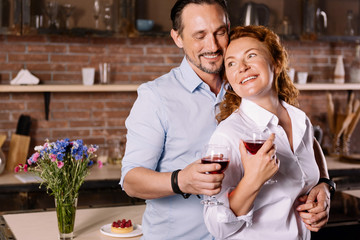 Man hugging woman from behind