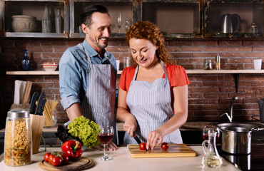 Senior couple in kitchen preparing dinner