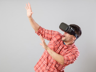 Man with virtual reality glasses showing gesture