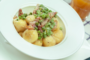 Potato dumplings with fried onion and bacon