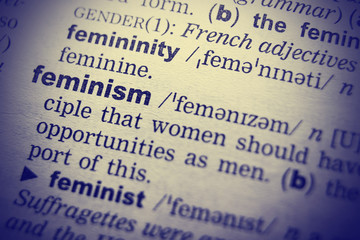 Feminism word in English dictionary. Close-up shot