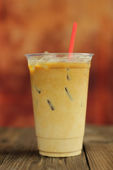 Iced coffee cafe latte on the wood