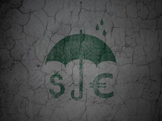 Protection concept: Money And Umbrella on grunge wall background