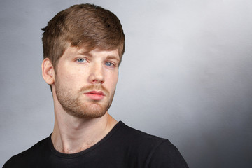 Fototapeta premium Casual young man looking at camera