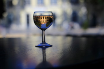 Reflection of the city in a glass of wine