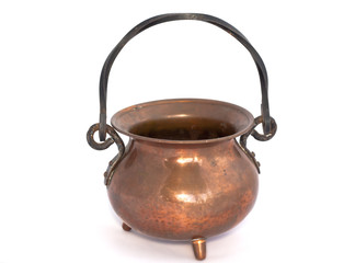 Old copper pot on a white background