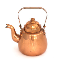 Old copper kettle on a white background