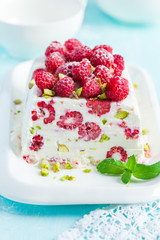 semifredo, italian ice cream dessert, with raspberry and pistach