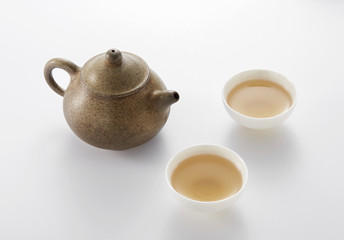 Chinese teapot and cups on white background