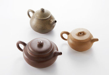 Chinese teapot and cups on white background