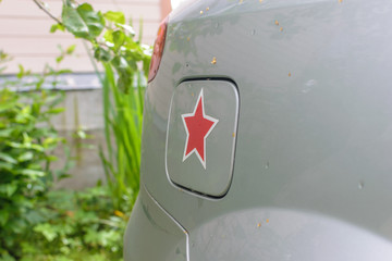 Red five-pointed star on the lid of the car`s tank