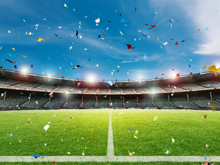confetti celebration in soccer field background © phonlamaiphoto