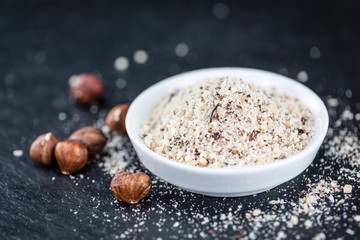 Grounded Hazelnuts on a slate slab