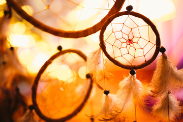 black and white photo of a dream catcher at sunset purple dark background