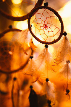 black and white photo of a dream catcher at sunset purple dark background