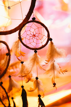 black and white photo of a dream catcher at sunset purple dark background