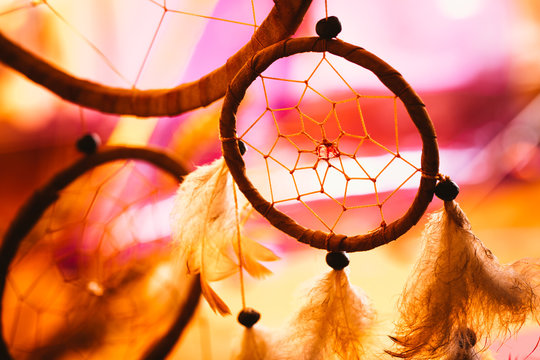 black and white photo of a dream catcher at sunset purple dark background
