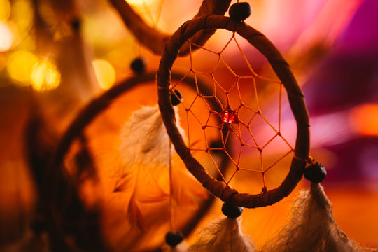 black and white photo of a dream catcher at sunset purple dark background