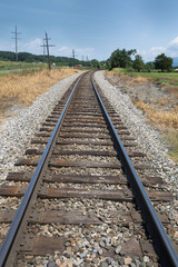 Fototapeta na wymiar Train tracks with blue sky in Luray, Virginia.