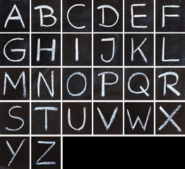 Alphabet drawing on a chalk blackboard. Chalk letters.