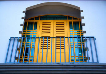 house old balcony with yellow window day