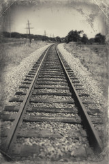 Fototapeta na wymiar Train tracks with blue sky in Luray, Virginia black and white.