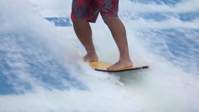 Cruise ship stand up surf wave pool recreation. Fun and recreation onboard of luxury cruise ship in the Caribbean Ocean. Vacation entertainment in pool built for surfing and boogey board.
