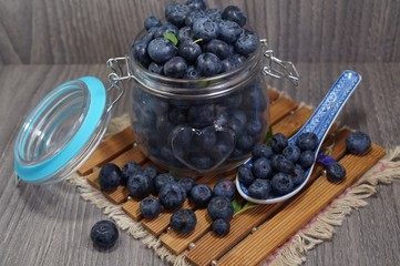 Freshly picked blueberries in jar . Juicy and fresh blueberries - Blueberry antioxidant. - Concept for healthy eating and nutrition