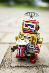 Old classic robot toys play music on street