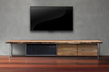 Led tv on concrete wall with wooden table living room