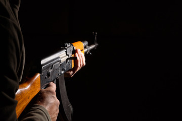 Kalashnikov assault rifle close-up in the dark
