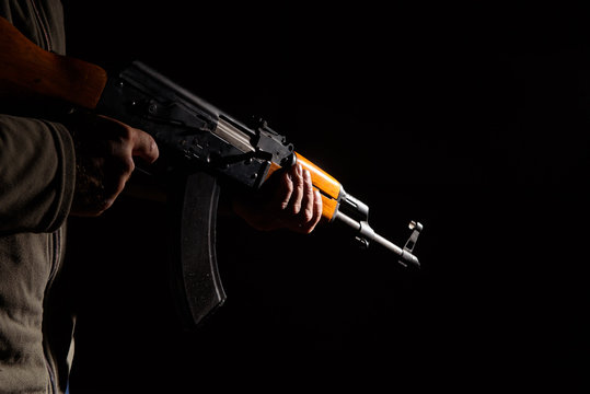 Kalashnikov assault rifle close-up in the dark
