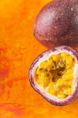 Passion fruit on the terracotta background vertical