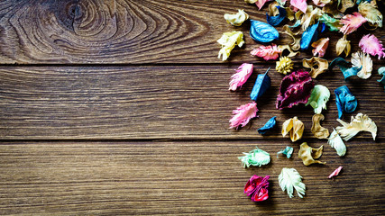 Fototapeta na wymiar aromatherapy potpourri mix of dried aromatic flowers on wooden b