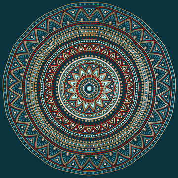 Drawing of a floral mandala in red, turquoise, gold and blue colors on a dark background