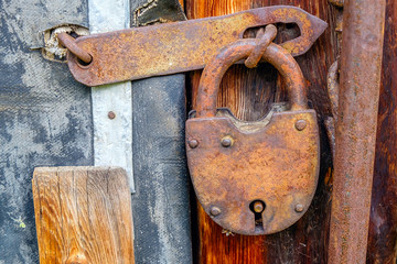 Vintage padlock on wooden door