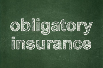 Obraz premium Insurance concept: Obligatory Insurance on chalkboard background